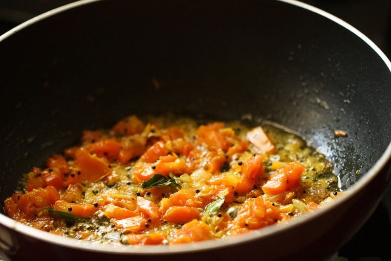 sautéing onion-tomato mixture till tomatoes soften. 