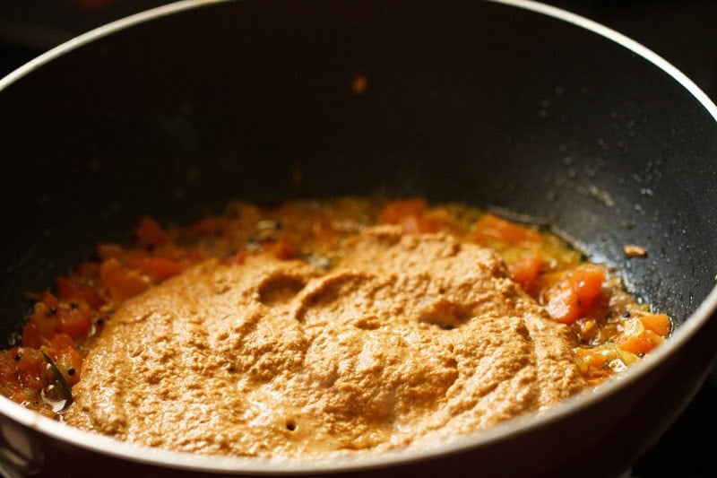 prepared masala paste added to the onion-tomato mixture.