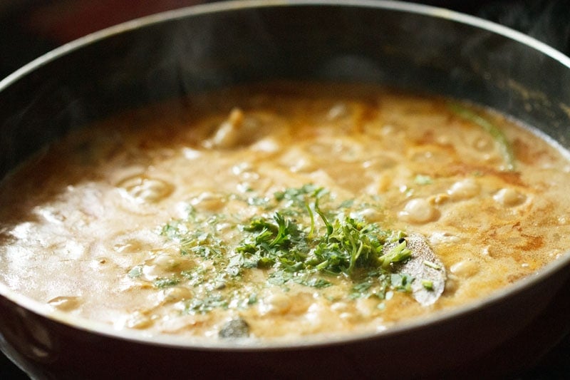 chopped coriander leaves added to chickpea curry. 