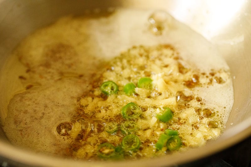 finely chopped ginger and chopped green chilies added to pan. 