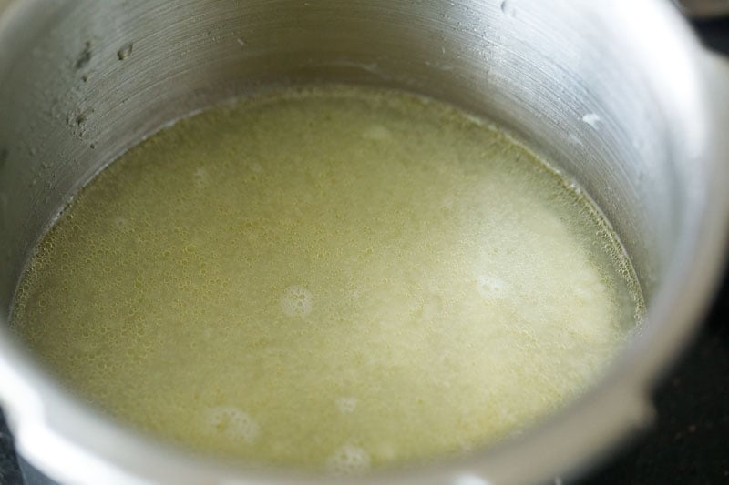 stock or broth added to cooker.