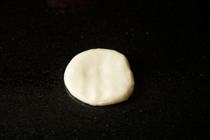 dough ball kept on the kitchen countertop for parotta recipe. 