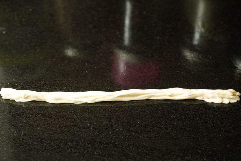 long strips of dough collected for parotta recipe. 