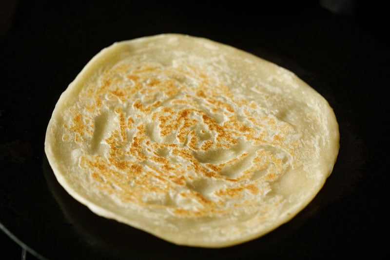 one side of the malabar paratha crisp and golden. 