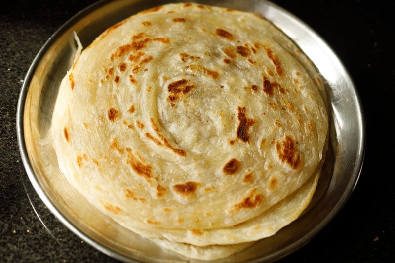 roasted malabar paratha on a plate. 
