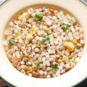 closeup photo of sabudana khichdi in a cream plate.