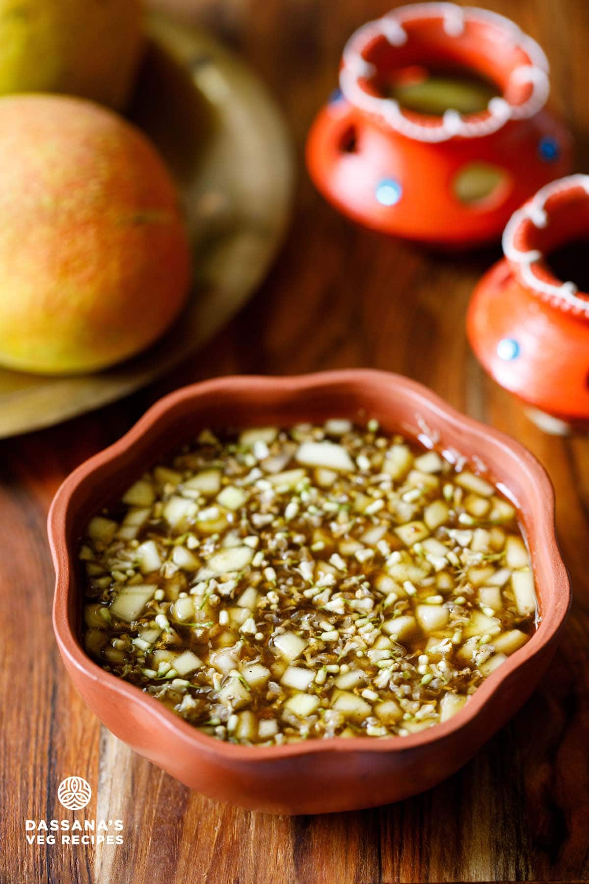 ugadi pachadi in a brown colored earthen bowl.