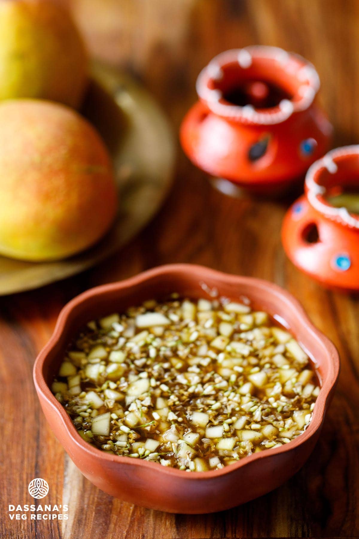 ugadi pachadi in a brown colored earthen bowl.
