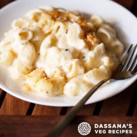 mac and cheese in a white plate with fork on the right side with text layovers.