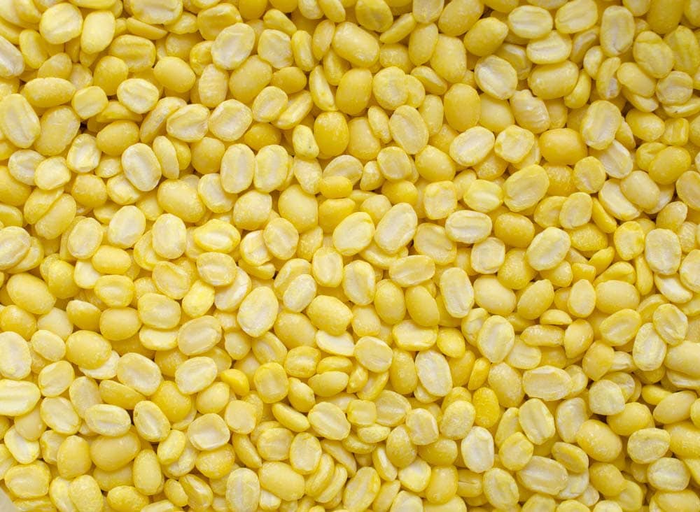 closeup photo of yellow uncooked moong lentils