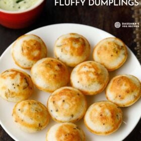 appe on a plate with coconut chutney in red bowl on top.