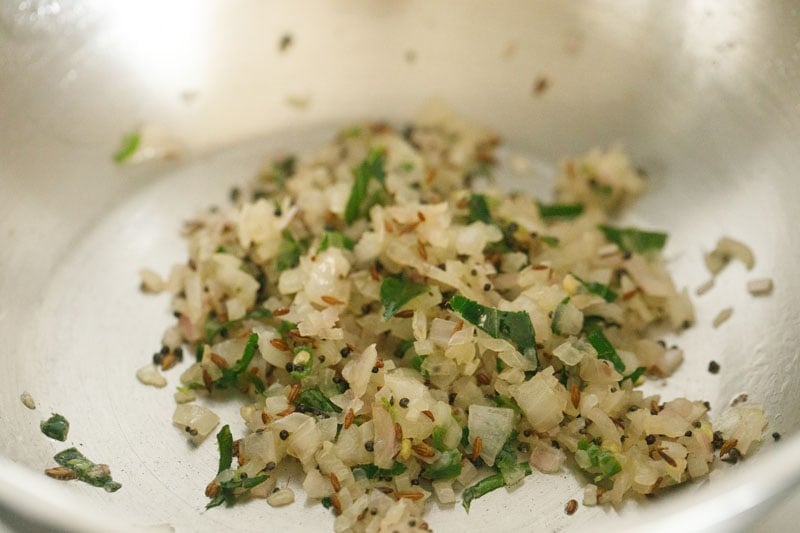 sautéing onion mixture for making tempering for appe. 