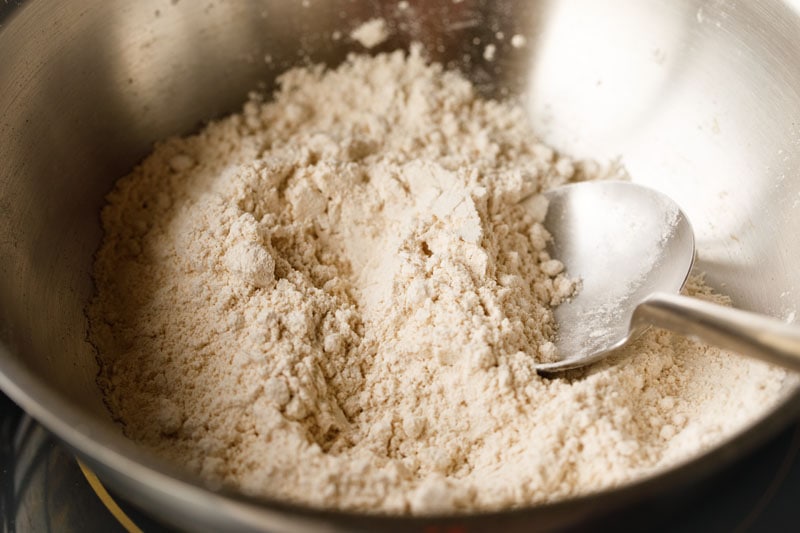 whole wheat flour added to hot ghee for making pinni. 