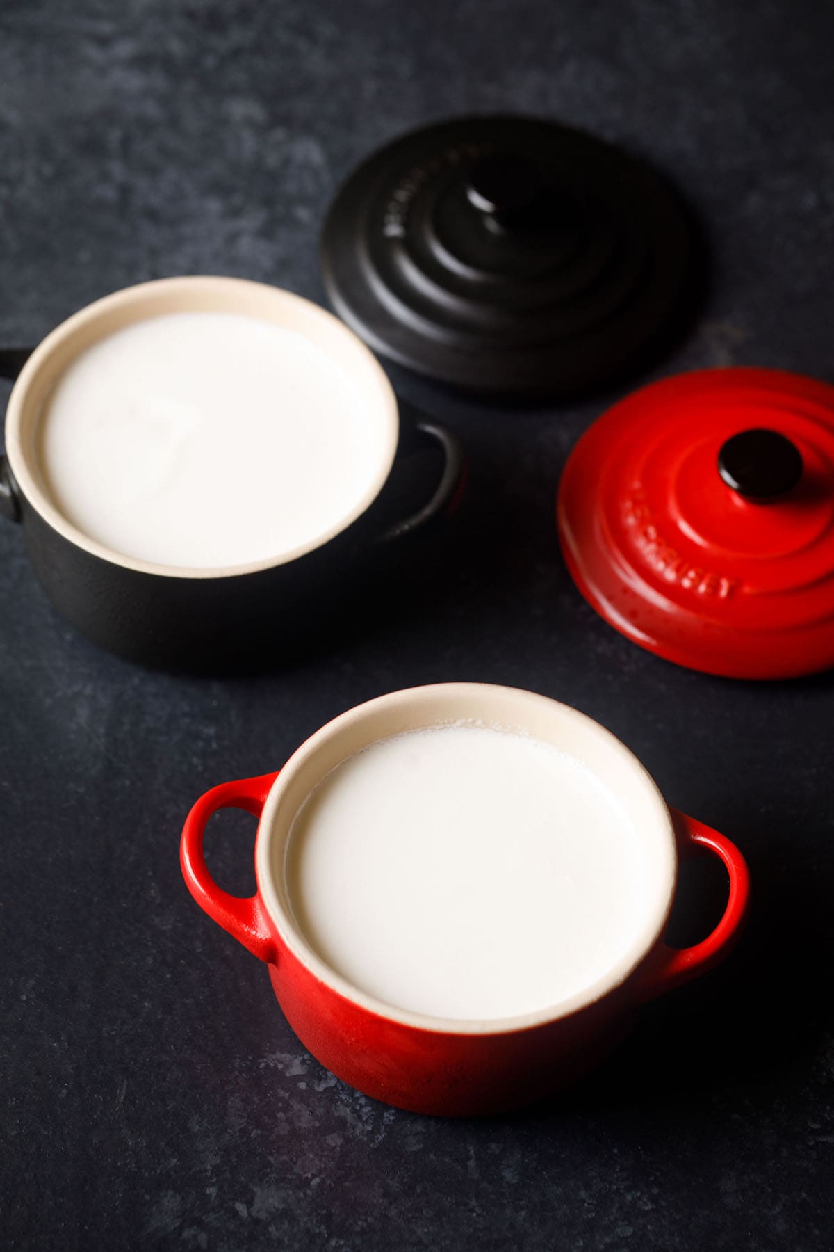 homemade curd in a red bowls with text layover. 