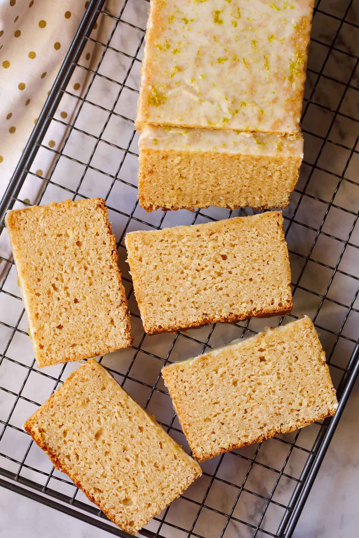 Lemon cake slices placed on wire rack. 