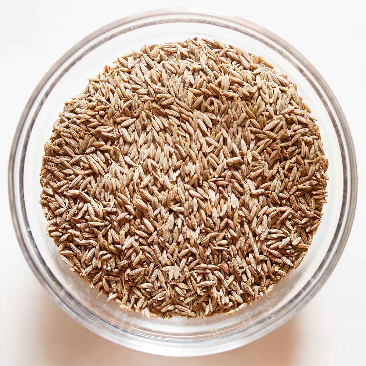 cumin seeds in a glass bowl.