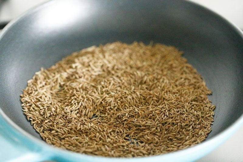 roasting cumin seeds for bhuna jeera powder.