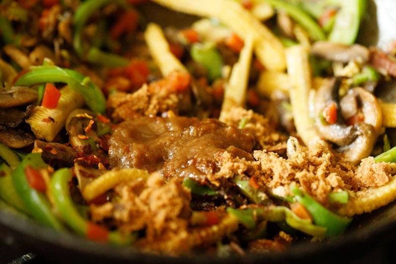 seasonings and sauces added to veggie-mushroom mixture.