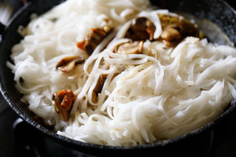 cooked and cooled rice noodles added to sauce for pad thai recipe.
