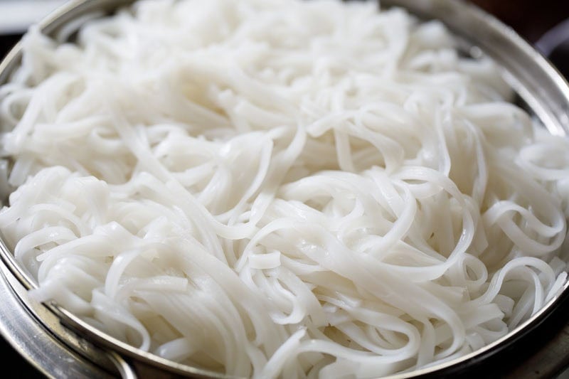 cooling cooked rice noodles.
