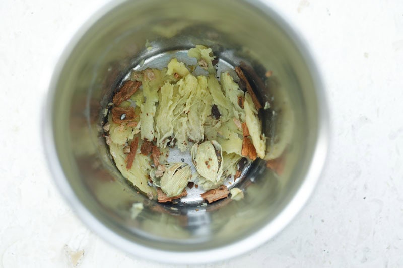 ginger and whole spices crushed in the mortar. 