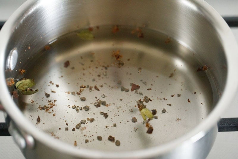 water and crushed spices added to another saucepan. 