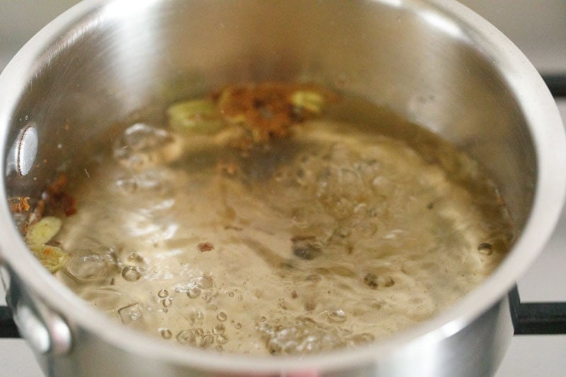 boiling spiced water to make irani tea decoction. 
