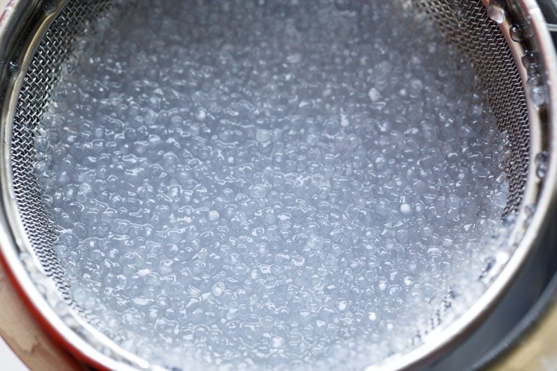 rinsing cooked sago pearls.