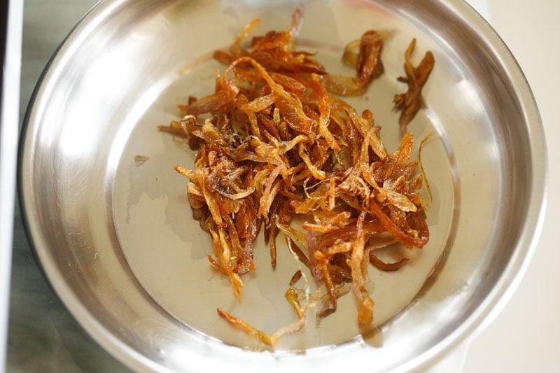 1 to 2 tablespoons of golden fried onions kept aside on a plate for garnishing. 