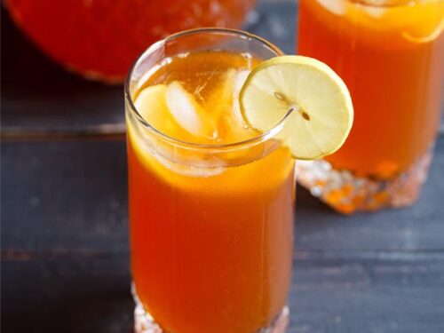 iced tea with lemon, ice cubes in two glasses.