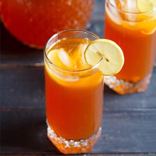 iced tea with lemon, ice cubes in two glasses.