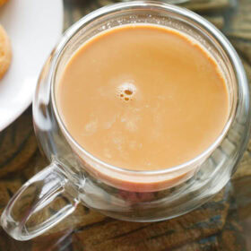 top shot of irani chai or irani tea in a glass cup.