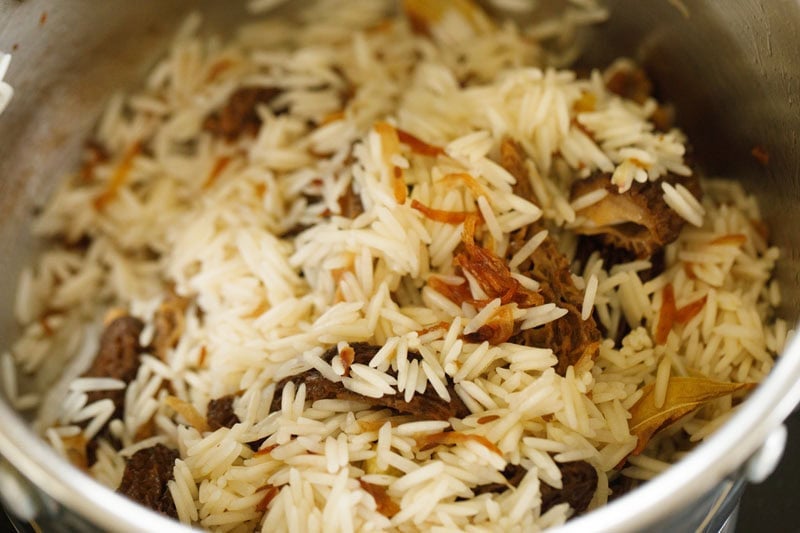 sautéing rice with spices and morel mushrooms. 