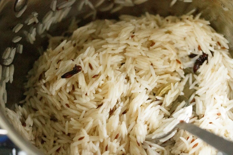 sautéing rice with whole spices.