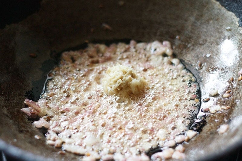 ginger-garlic paste added to sautéing onions.
