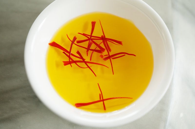 saffron strands soaking in warm water. 