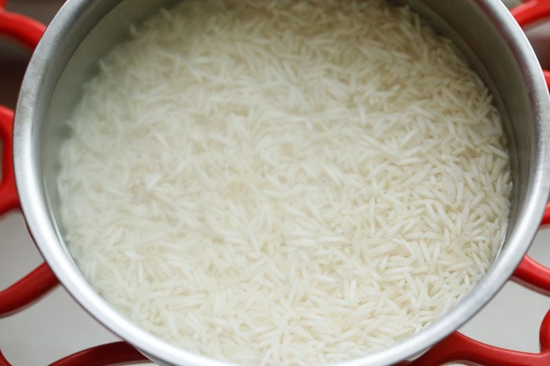 soaking basmati rice to make gucchi pulao. 