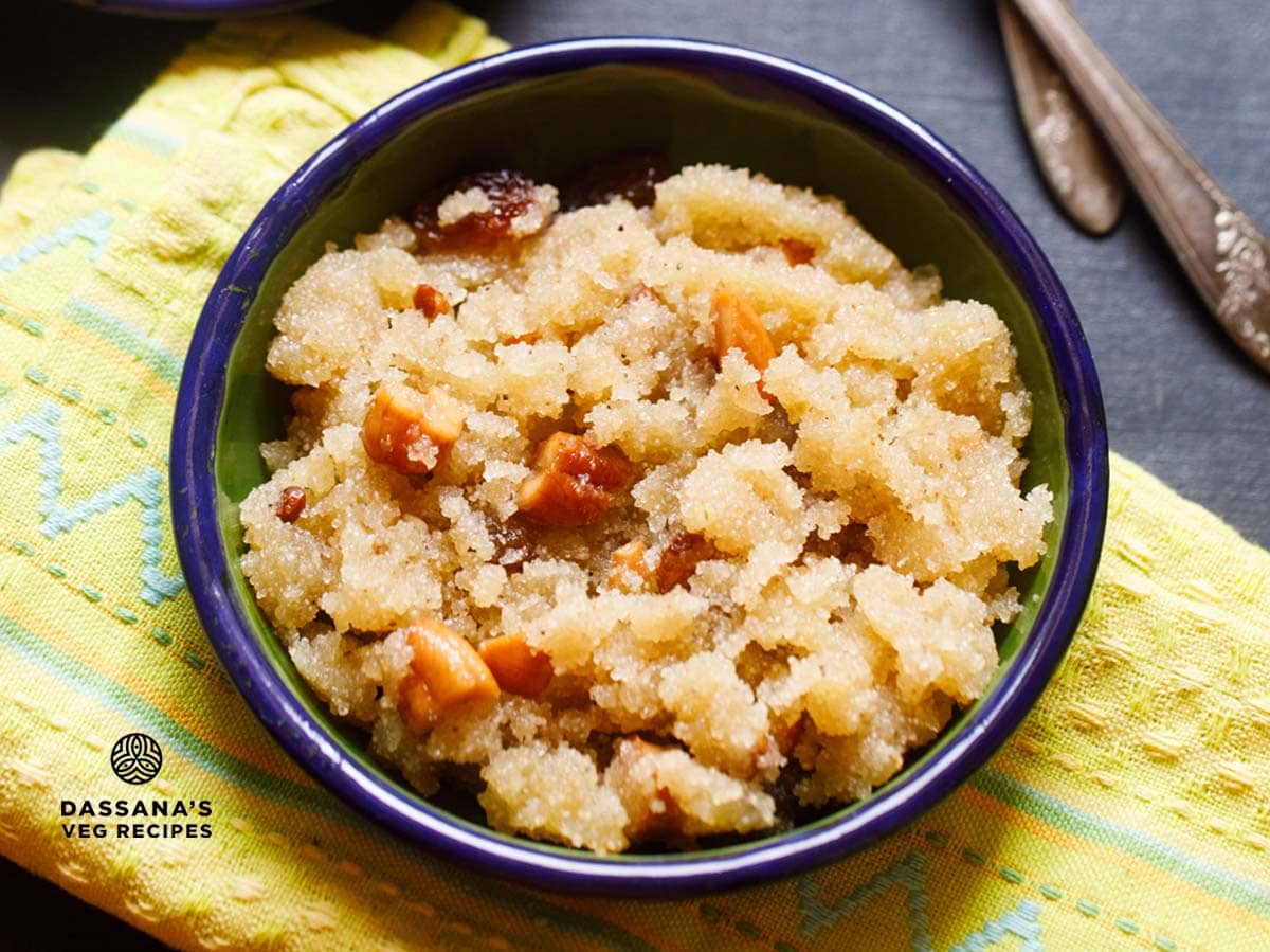 sooji halwa served in a blue bowl on a folded yellow napkin.
