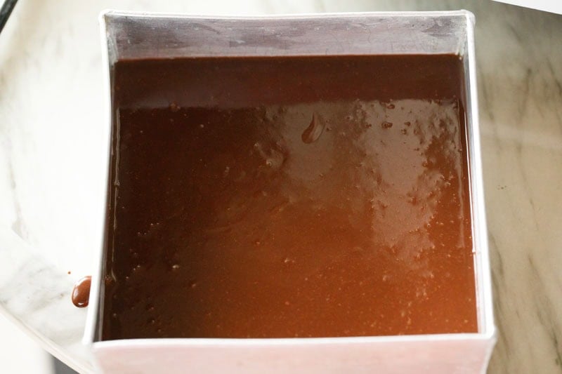 brownie batter in a cake tin.