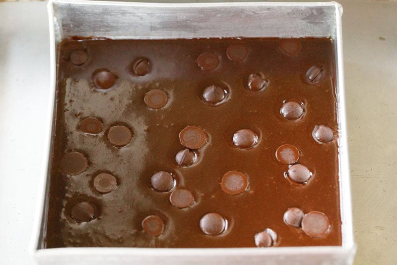 chocolate chips placed on batter in the baking pan.