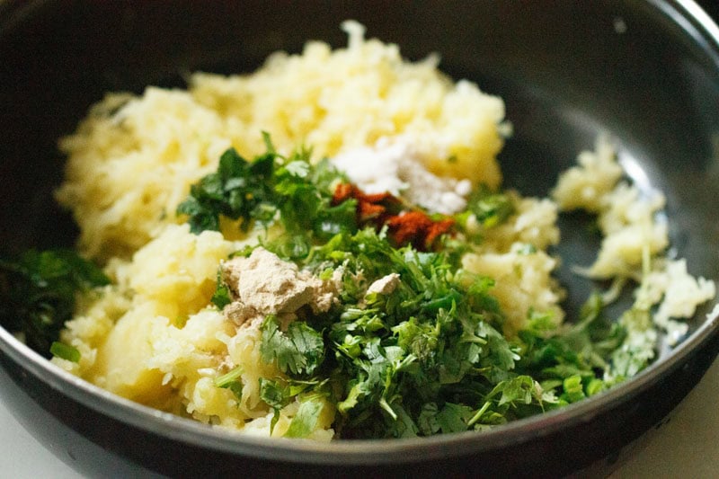 herbs and spices added to grated potatoes.