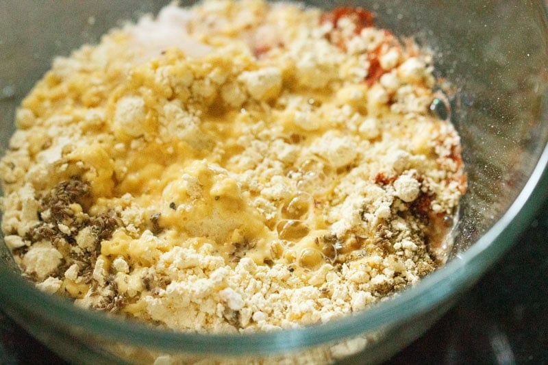 water added to the batter ingredients in a bowl.