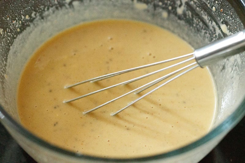 smooth batter with a whisk in the bowl.