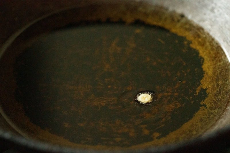 testing a small droplet of batter in hot oil.