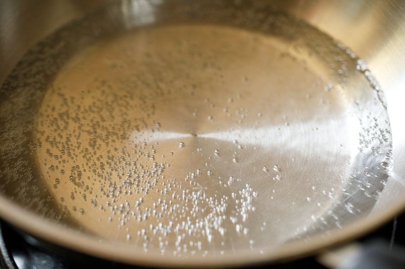 water simmering in pan.