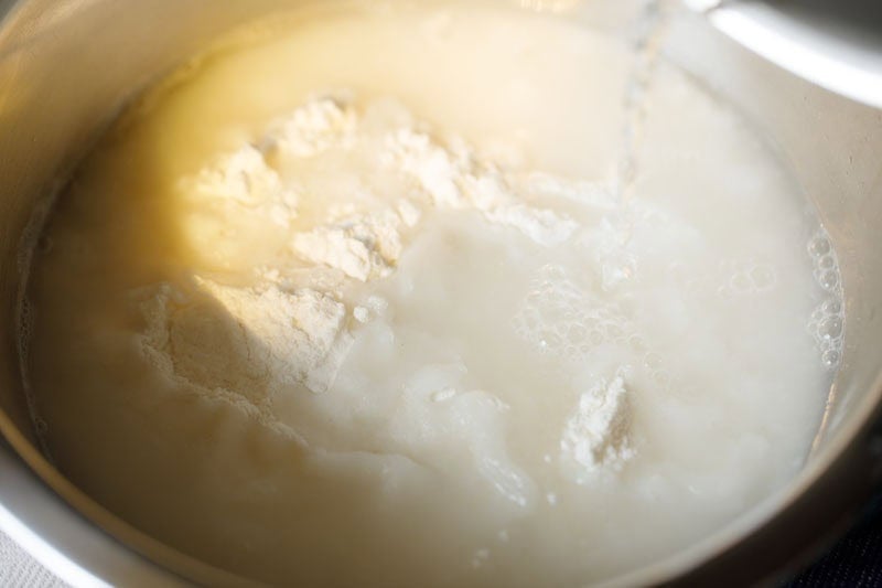 hot water added to rice flour for idiyappam recipe.