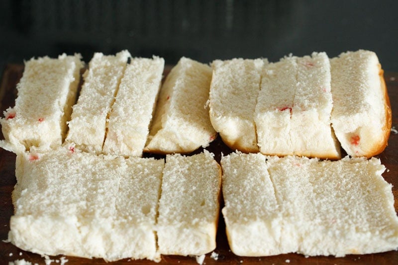 Sliced bread on chopping board.