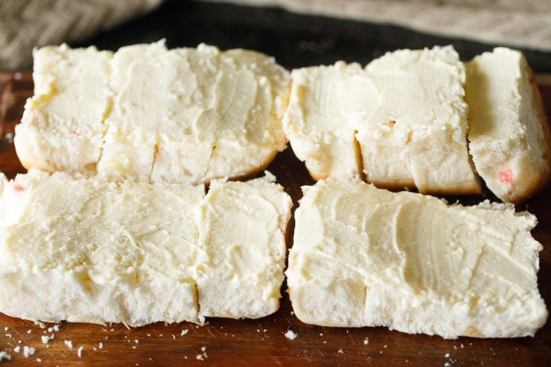 Sliced bread with butter or maska spread generously.