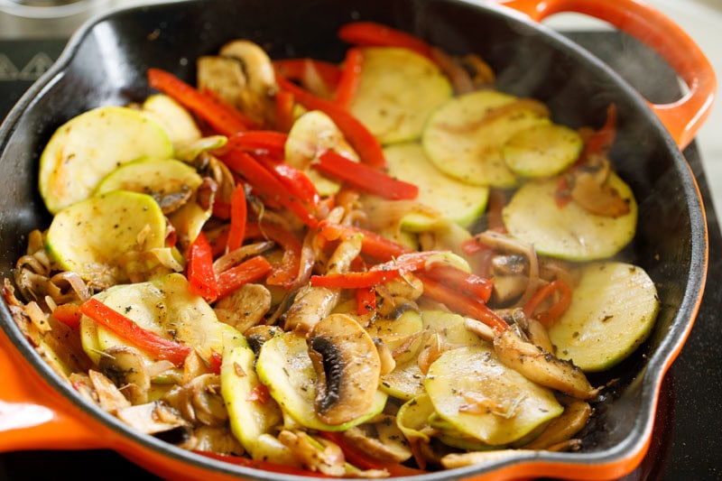 Sautéed vegetables in a skillet.