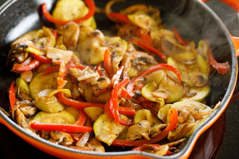 Sautéed vegetables in a skillet.